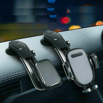Two black adjustable phone holders mounted on a car dashboard with blurred city lights background
