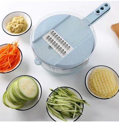 Multi-functional kitchen mandoline slicer with handle surrounded by bowls of sliced vegetables including carrots, cucumbers, grated and sliced potatoes.