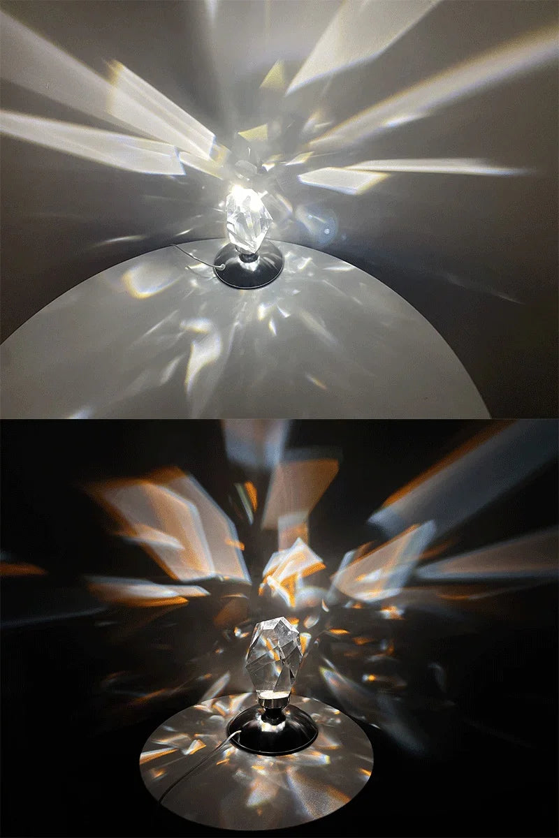 Crystal prism lamp casting colorful light reflections on white and black surfaces in a dark room