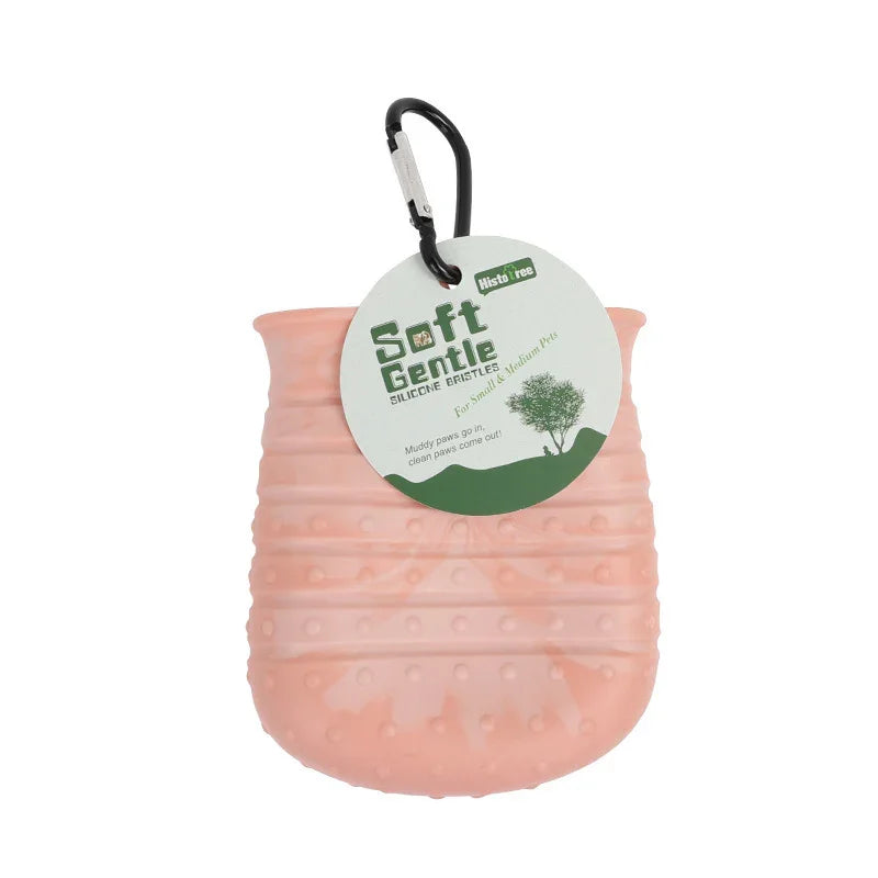 Soft Gentle silicone bristle pet paw cleaner in pink with a hanging carabiner hook for small and medium pets