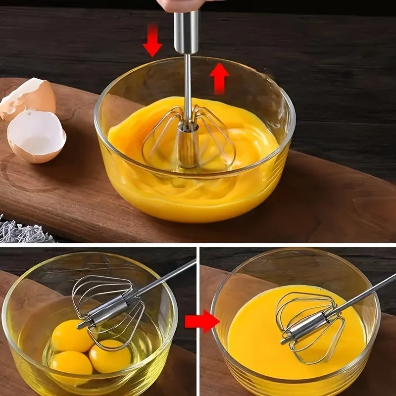Electric hand mixer whisking eggs in a glass bowl on a wooden board with eggshells nearby