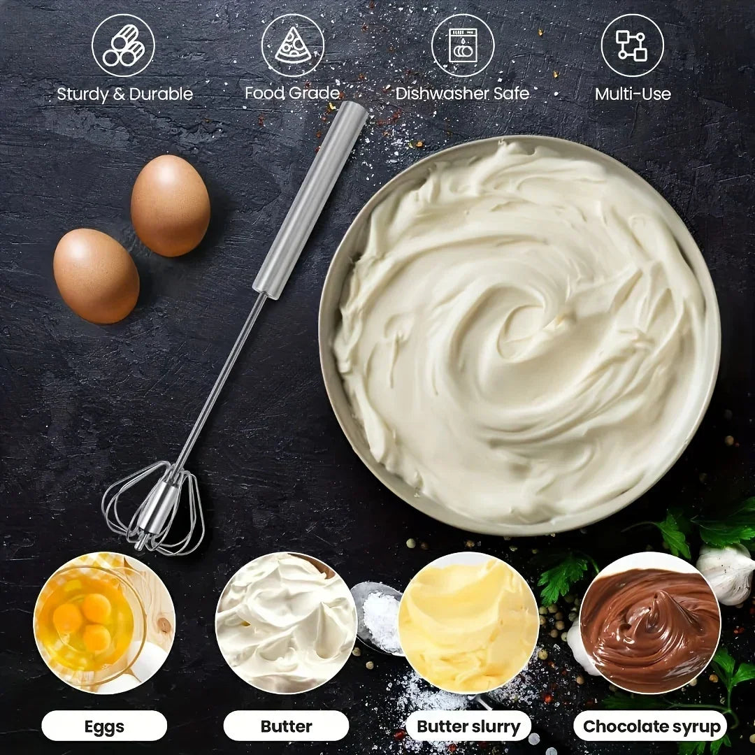 Stainless steel whisk beside whipped cream bowl, eggs, butter, butter slurry, and chocolate syrup on black surface