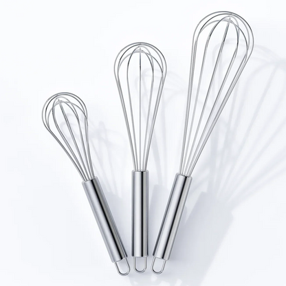 Set of three stainless steel kitchen whisks in small, medium, and large sizes on white background